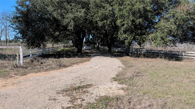 a view of yard covered with snow in front of house