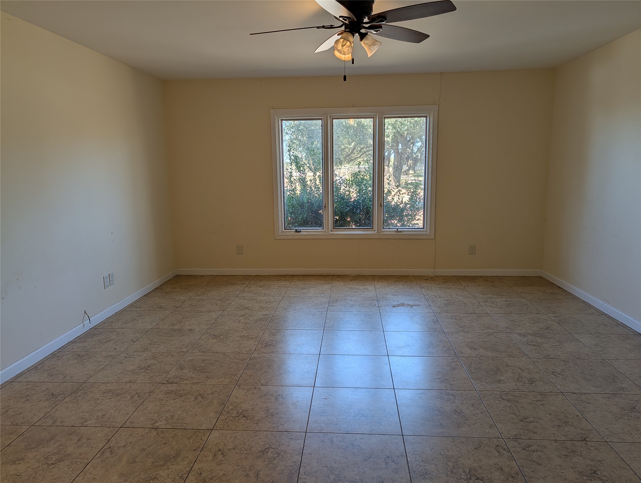 2368 Old Columbus Road North Sealy, TX 77474 - Photo 13 of 16 an empty room with windows and fan