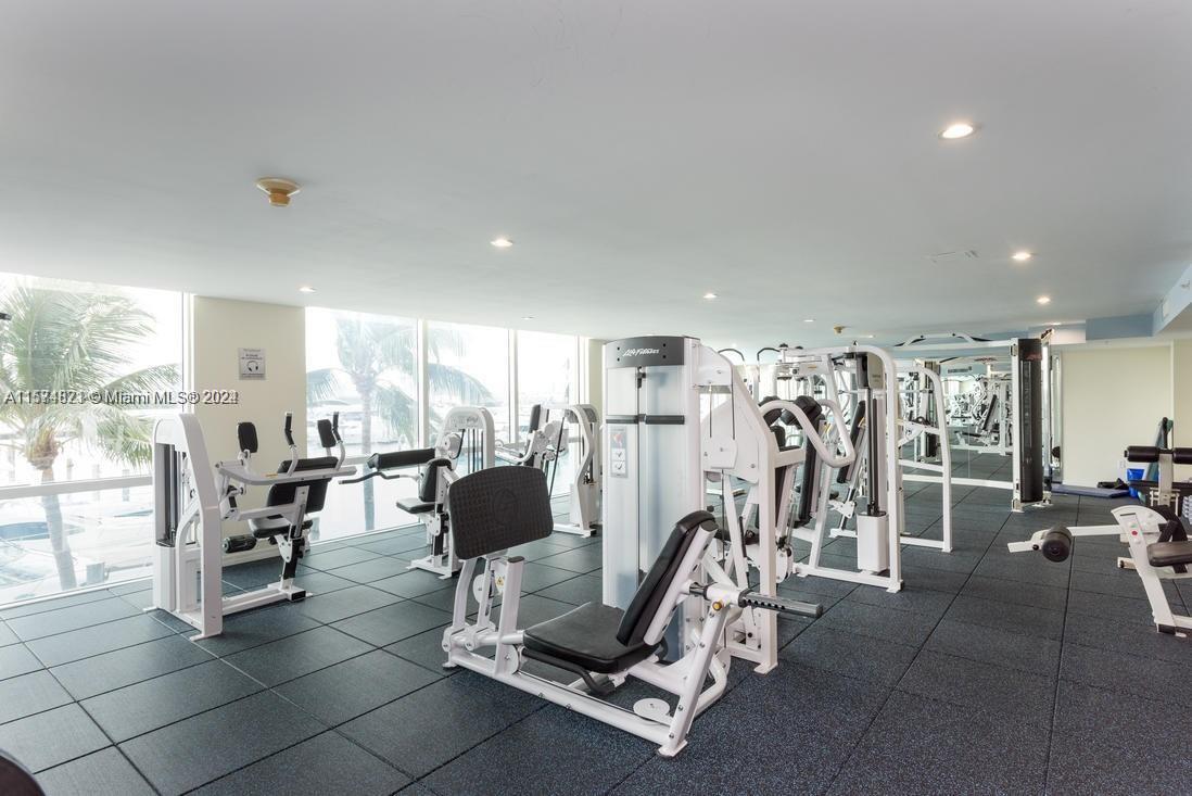 90 Alton Road, Unit 1502 Miami Beach, FL 33139 - Photo 21 of 29 a view of a room with gym equipment