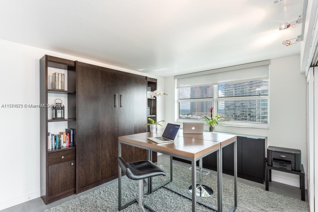 90 Alton Road, Unit 1502 Miami Beach, FL 33139 - Photo 8 of 29 a dining room with furniture and window
