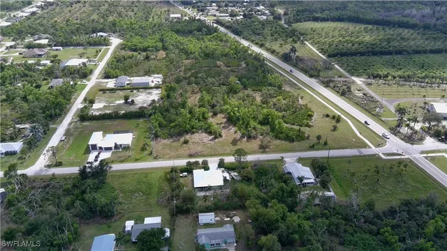 an aerial view of house with yard