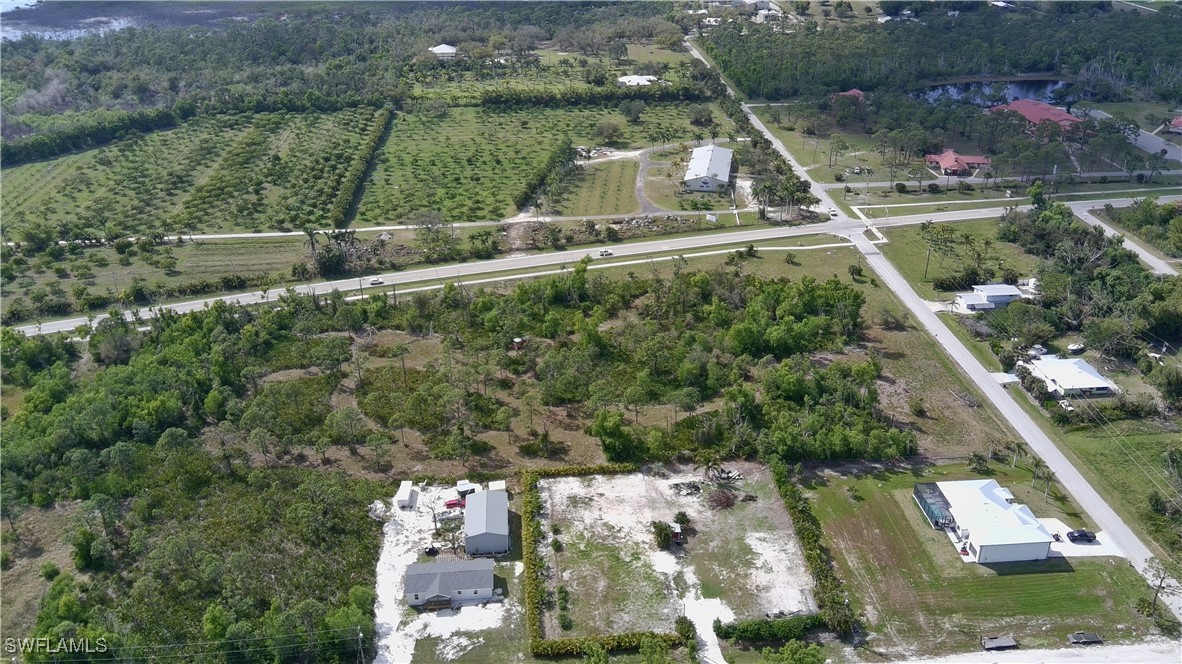 11900 Stringfellow Road Bokeelia, FL 33922 - Photo 7 of 8 an aerial view of residential houses with outdoor space