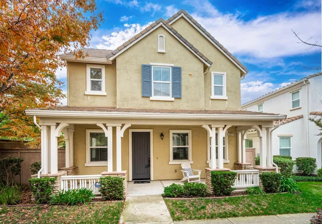 front view of brick house with a yard