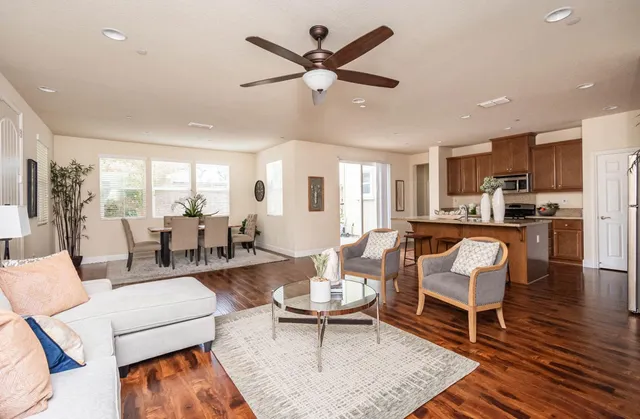 a view of a dining room with furniture window and wooden floor