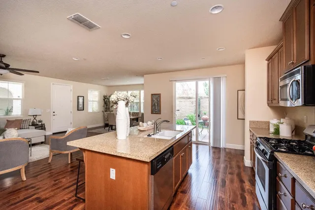 a bedroom with a large bed and a potted plant