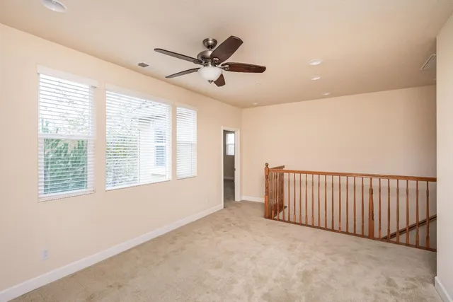 a white toilet sitting next to a bath tub