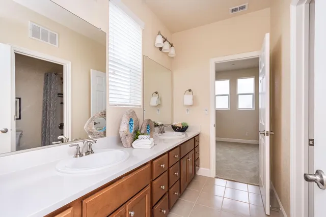 a spacious bedroom with a bed and window