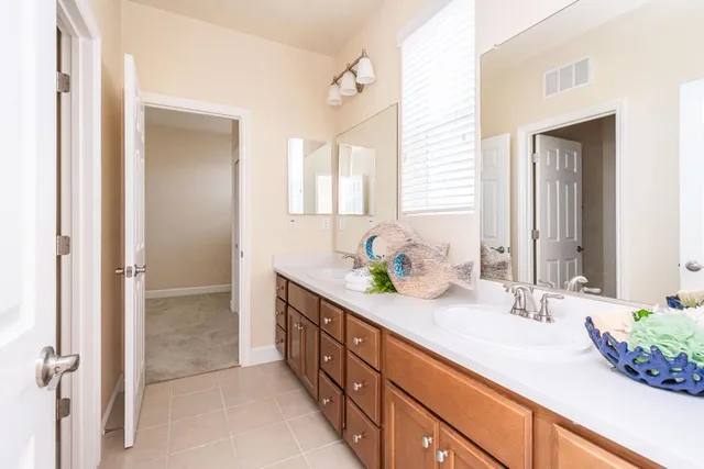 a bathroom with a granite countertop sink mirror and a