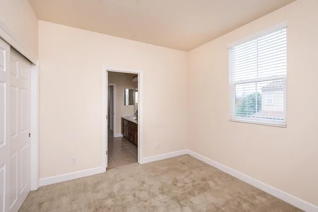 a bathroom with a tub sink and shower