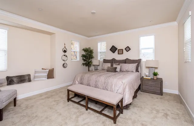 a bathroom with a granite countertop sink mirror and a bathtub