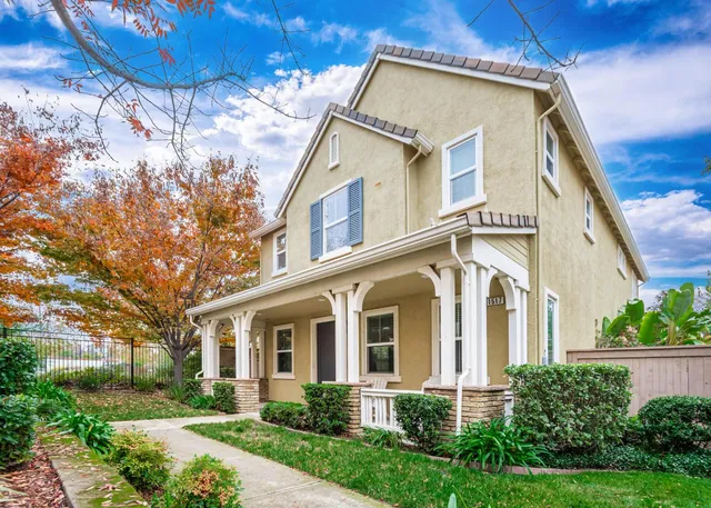 a front view of a house with garden
