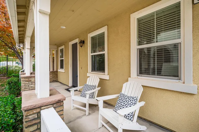 a view of a patio with a table and chairs