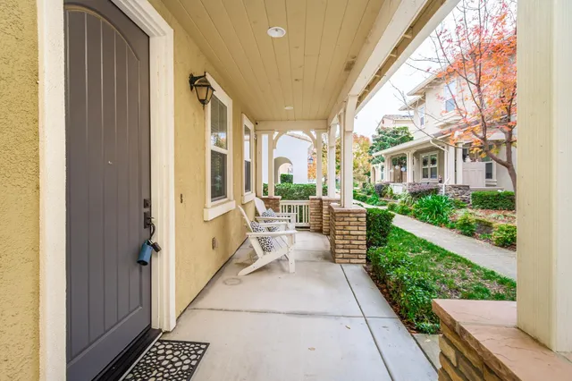 a living room with fireplace furniture and a wooden floor
