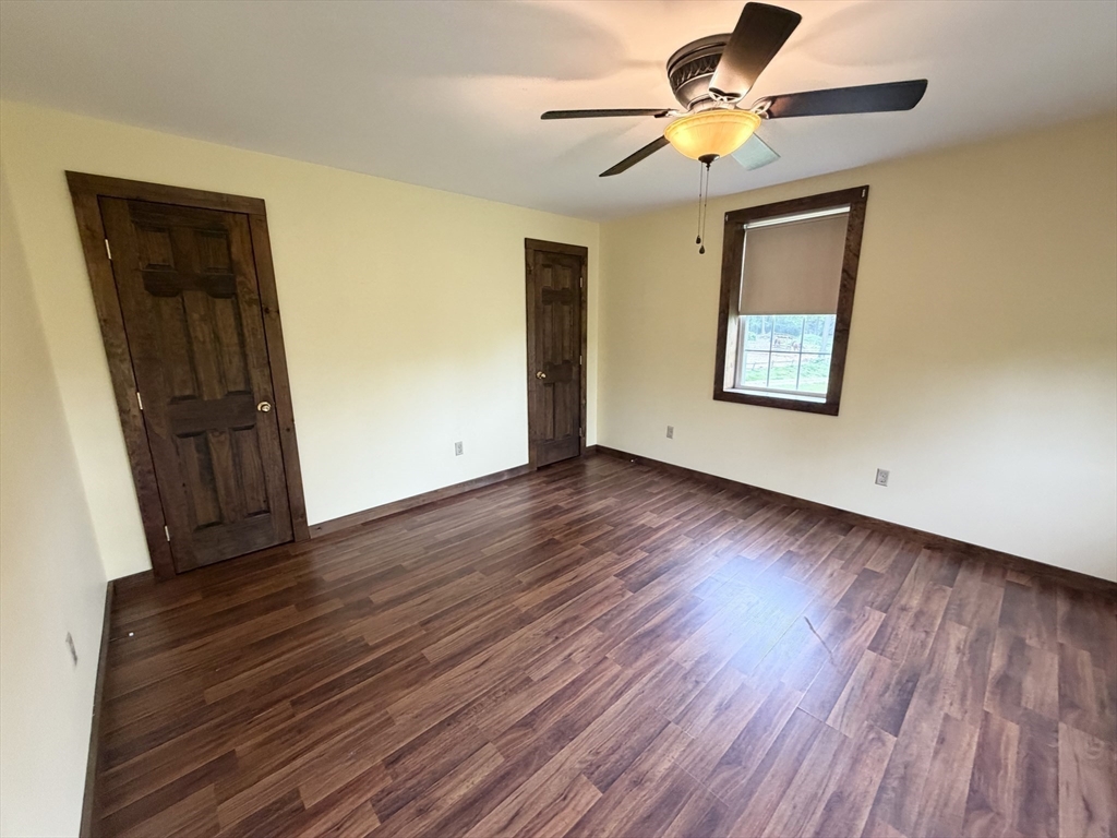 271 Lower Road Deerfield, MA 01342 - Photo 23 of 40 a view of an empty room with window and wooden floor