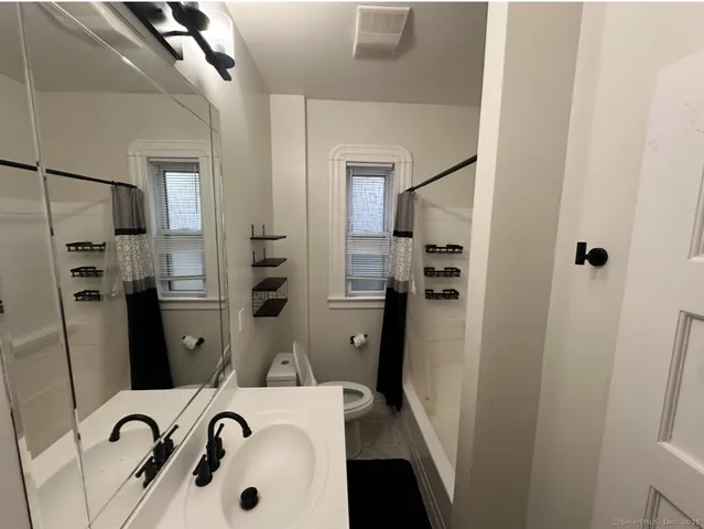 a bathroom with a sink and mirror