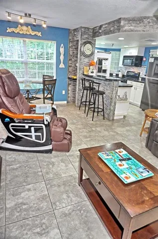 a living room filled with furniture and a table
