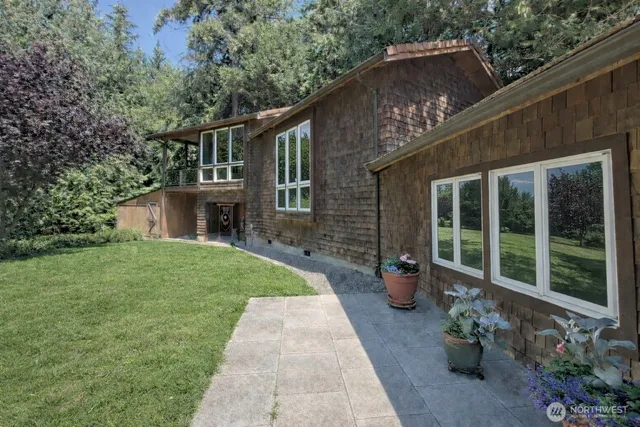 a front view of a house with sitting area