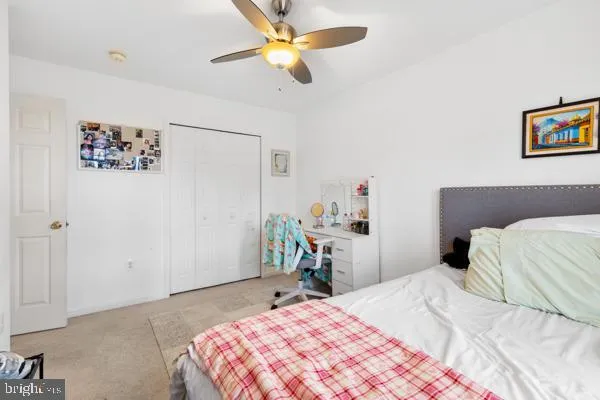 a bedroom with a bed and a table in it