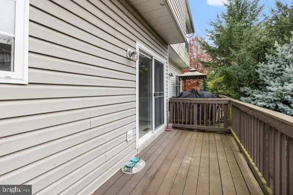 a view of balcony with deck and wooden floor