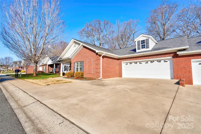 a view of a house with swimming pool and a yard