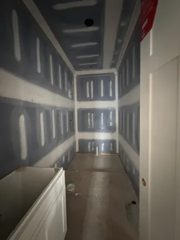 a bathroom with a bathtub and window