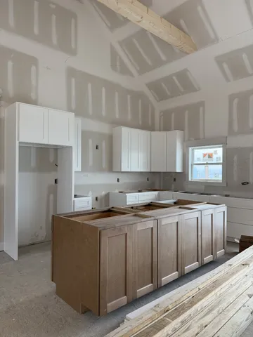 a kitchen with a sink and cabinets