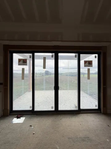 a view of front door with yard