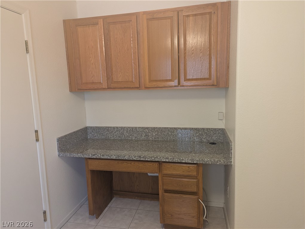 9433 Quail Ridge Drive Las Vegas, NV 89134 - Photo 15 of 23 Functional workspace with ample granite counter space and matching cabinetry provides an efficient home office solution.