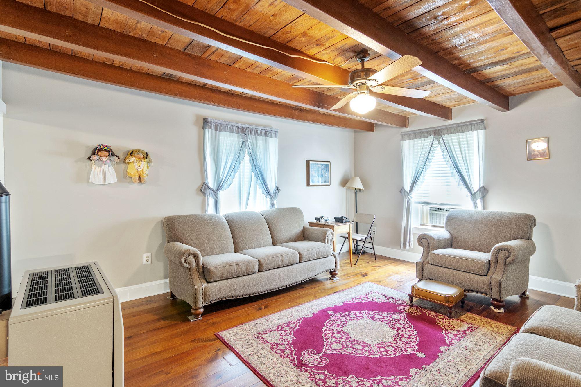 11023 Elk Run Road Catlett, VA 20119 - Photo 15 of 38 Living room with wood ceiling & beams