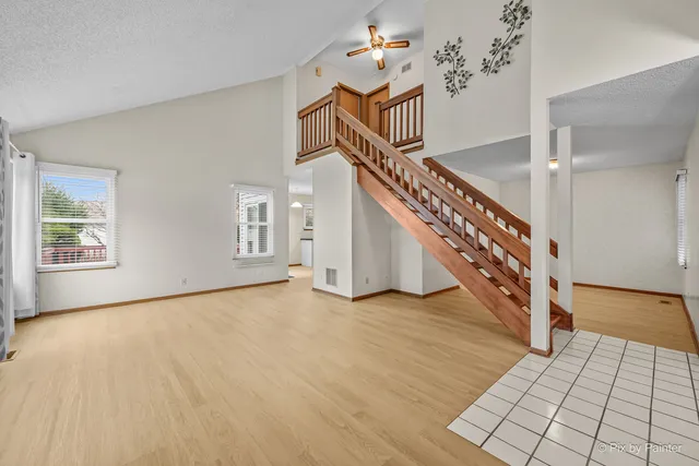 a view of an entryway with wooden floor