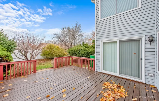 a view of a house with wooden deck