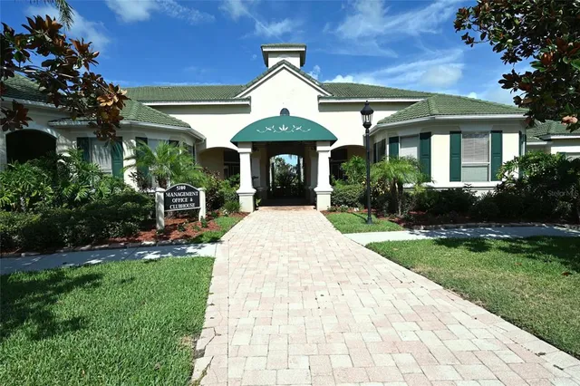 a view of a dining room with furniture and a chandelier