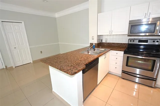 a kitchen with a stove and a microwave