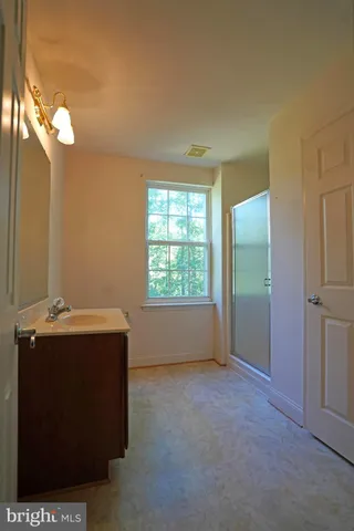a room with window and cabinet