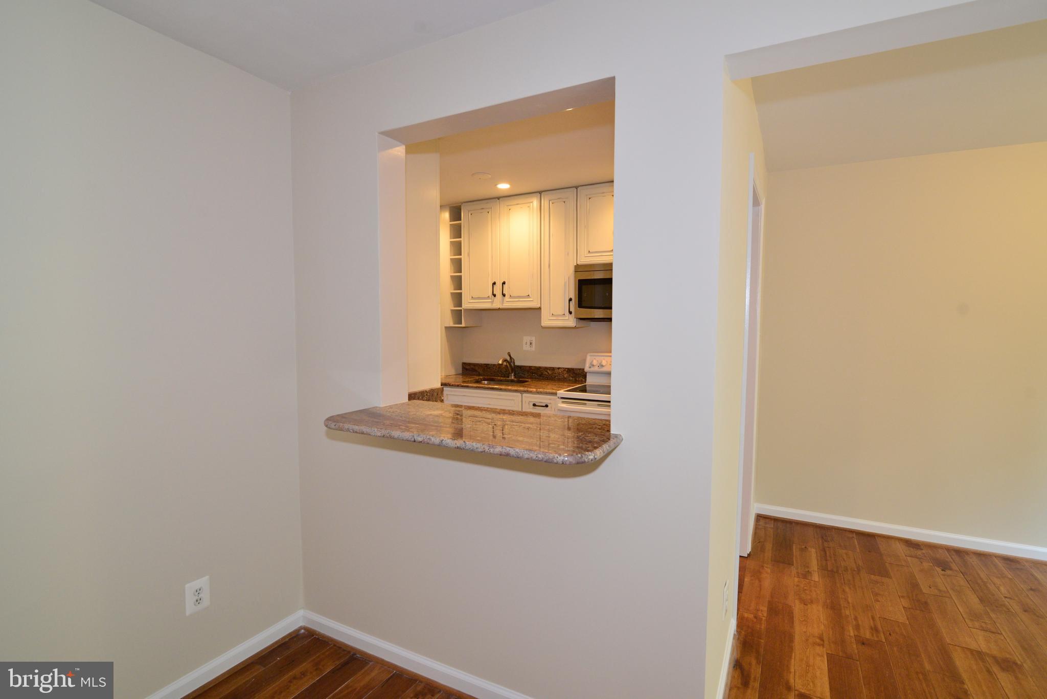 11882 St Trinians Court Reston, VA 20191 - Photo 10 of 35 "Pass-through" from living room to the kitchen.