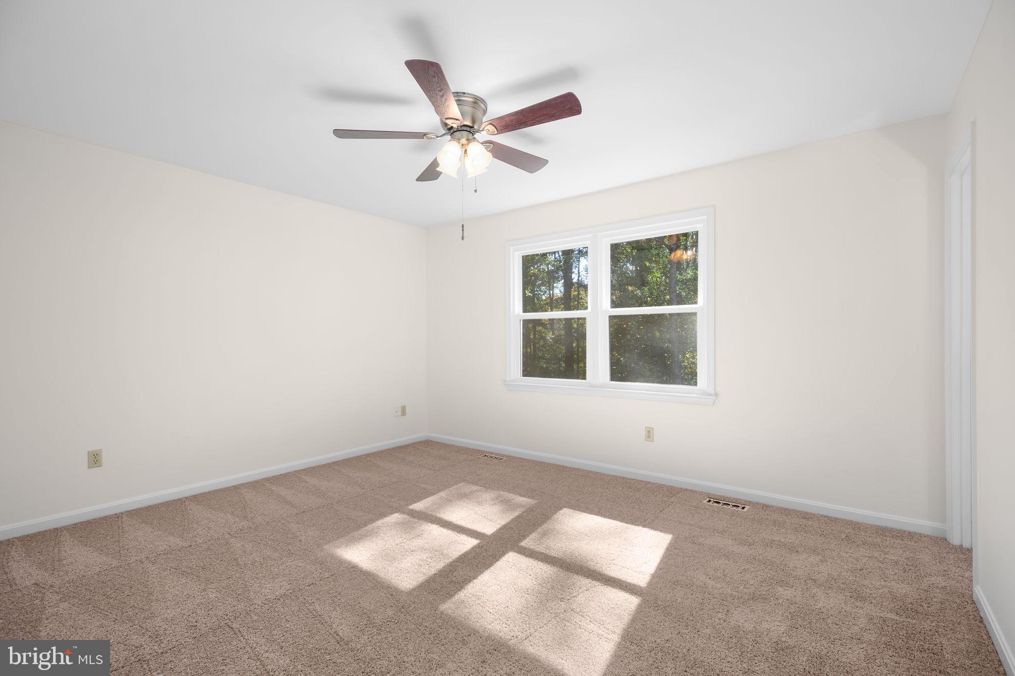 8 Rutledge Cove Ruther Glen, VA 22546 - Photo 16 of 46 an empty room with window and ceiling fan