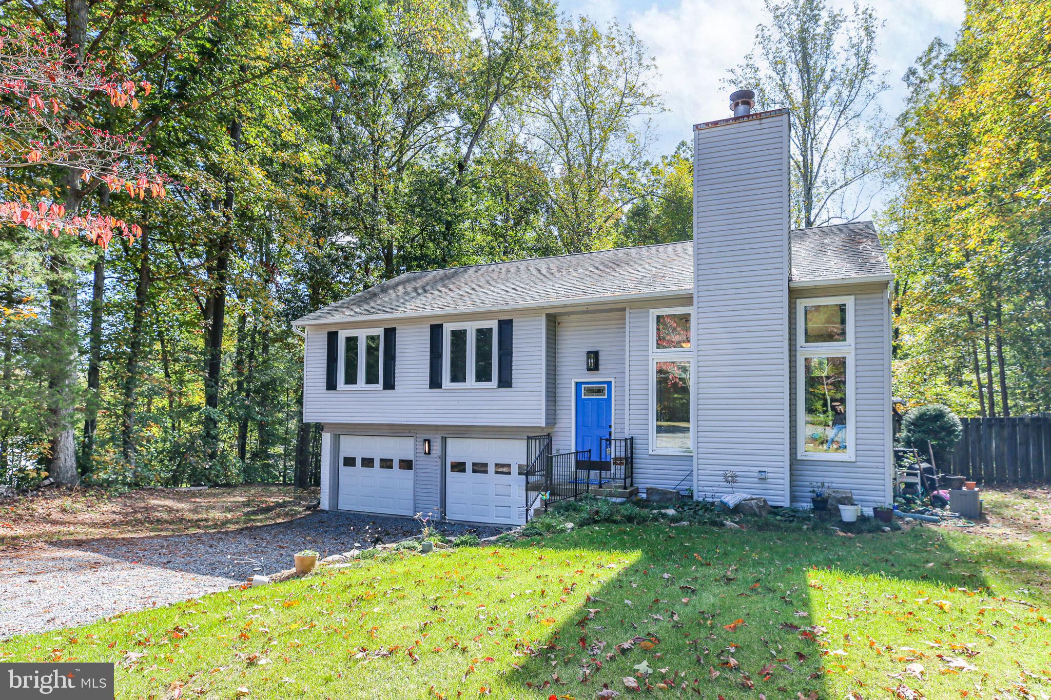 8 Rutledge Cove Ruther Glen, VA 22546 - Photo 2 of 46 a view of a house with a yard and sitting area