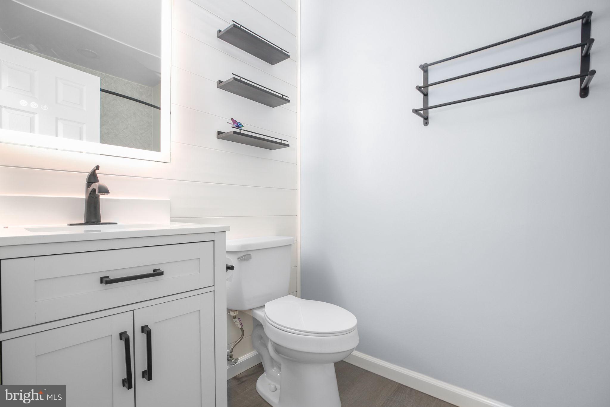 8 Rutledge Cove Ruther Glen, VA 22546 - Photo 23 of 46 a bathroom with a sink a toilet and a mirror