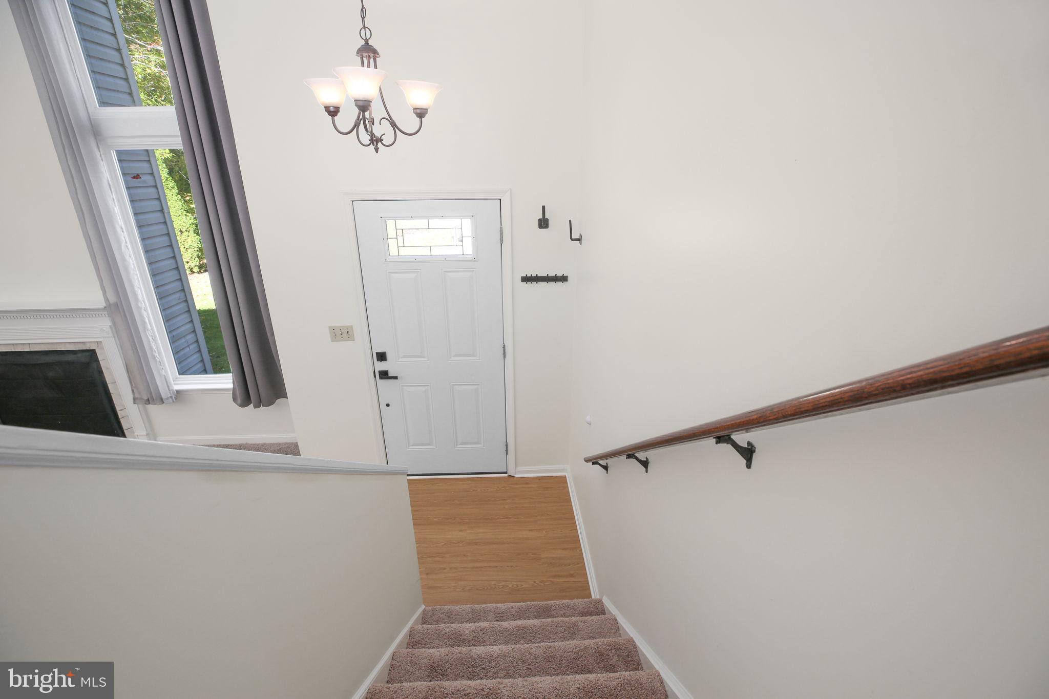 8 Rutledge Cove Ruther Glen, VA 22546 - Photo 3 of 46 a view of a hallway with windows