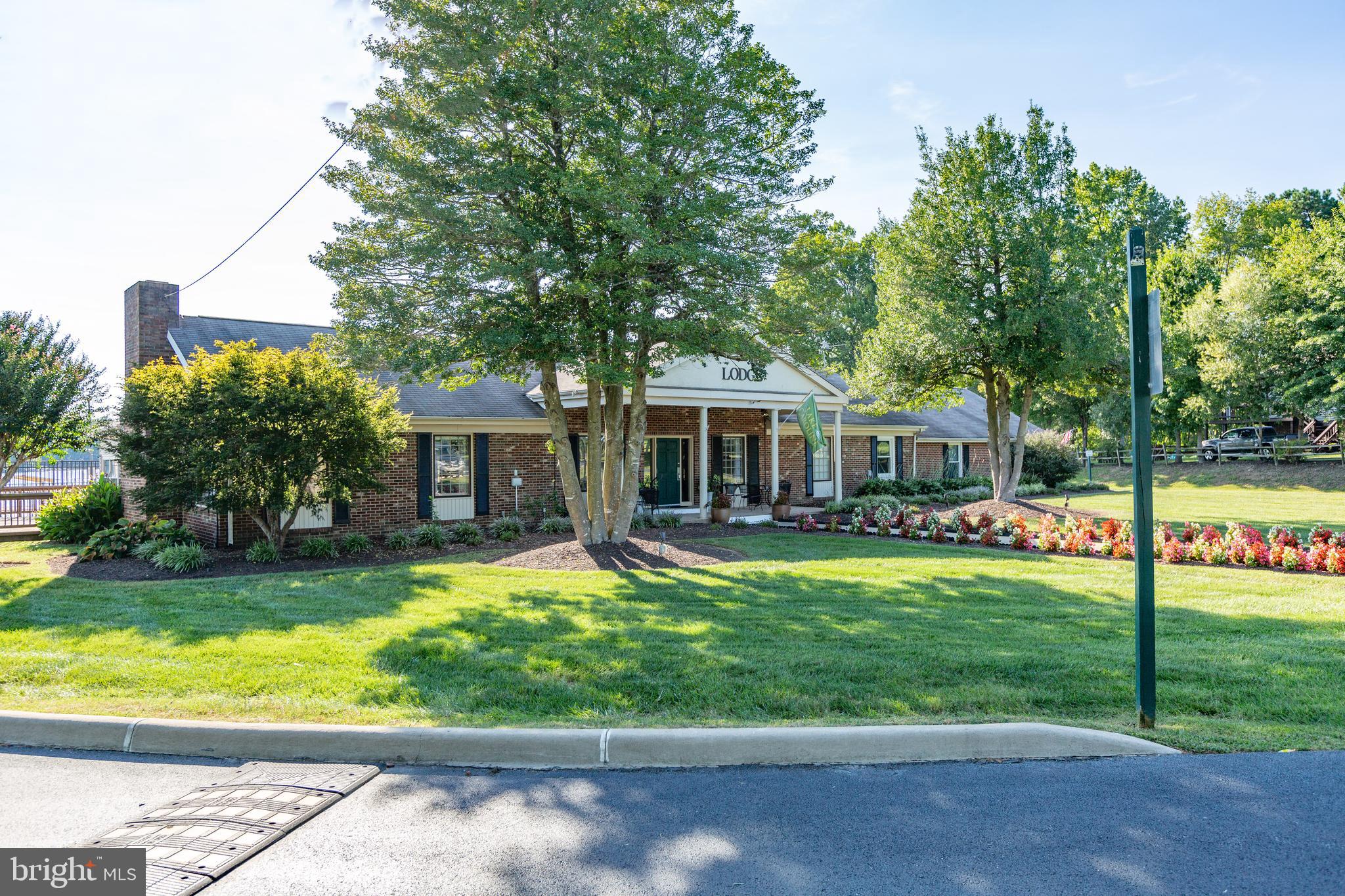8 Rutledge Cove Ruther Glen, VA 22546 - Photo 39 of 46 a front view of a house with swimming pool having outdoor seating
