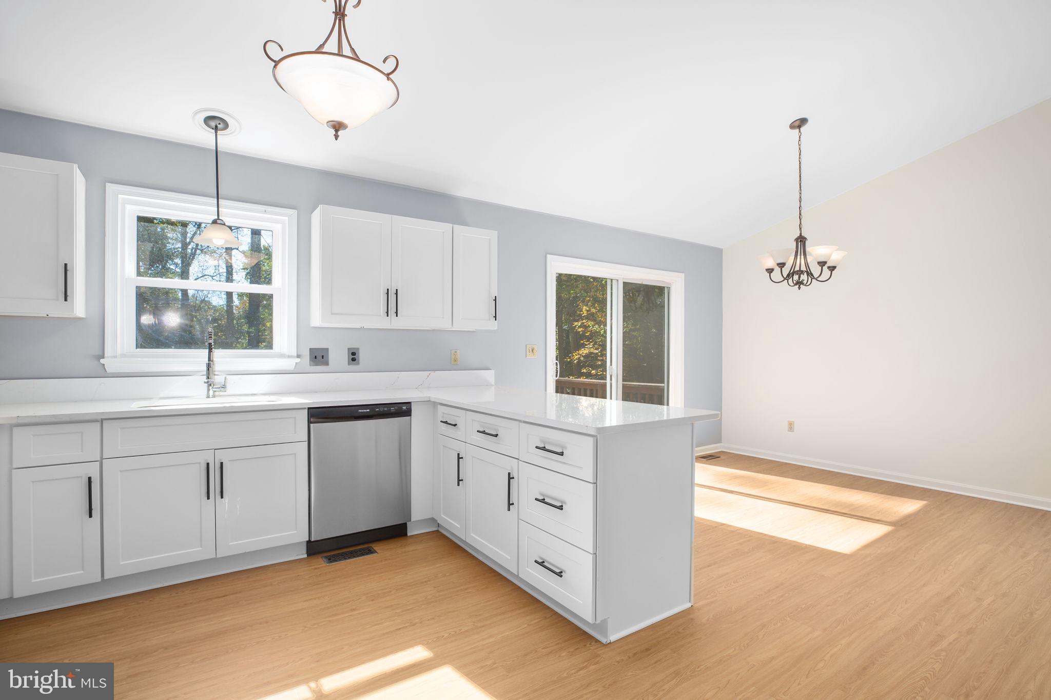 8 Rutledge Cove Ruther Glen, VA 22546 - Photo 8 of 46 a kitchen with white cabinets and window