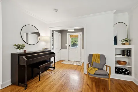 a kitchen with stainless steel appliances granite countertop a sink and a refrigerator