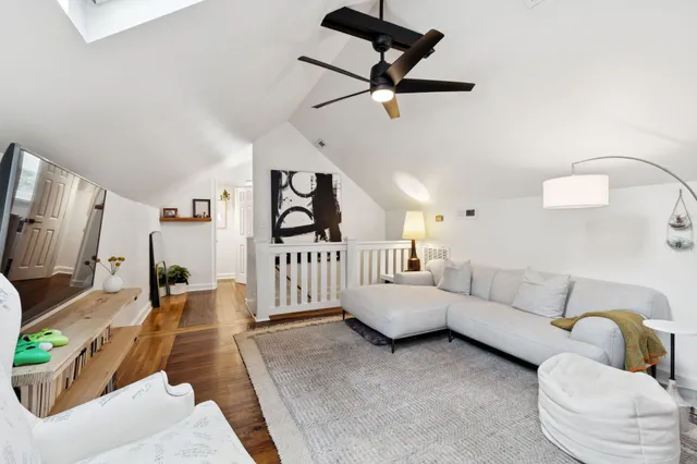 a bed room with a bed mirror and a window