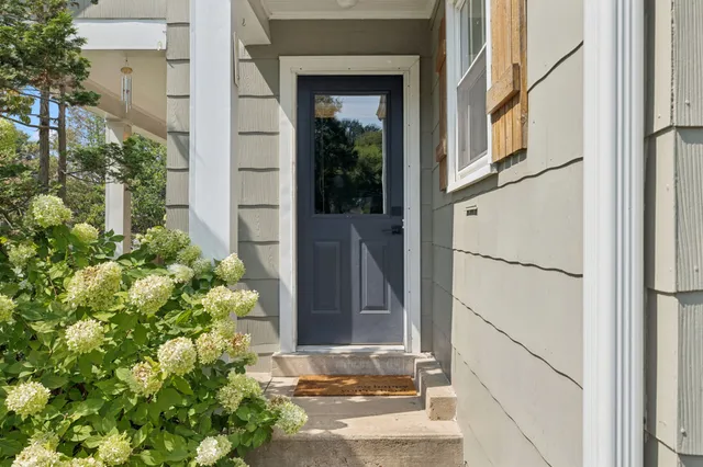 a view of a swimming pool with a yard