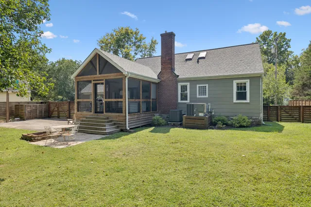 an aerial view of a house with a garden and yard
