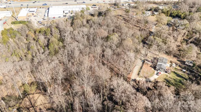 an aerial view of houses with yard