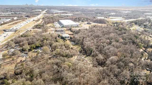 an aerial view of residential building and parking space