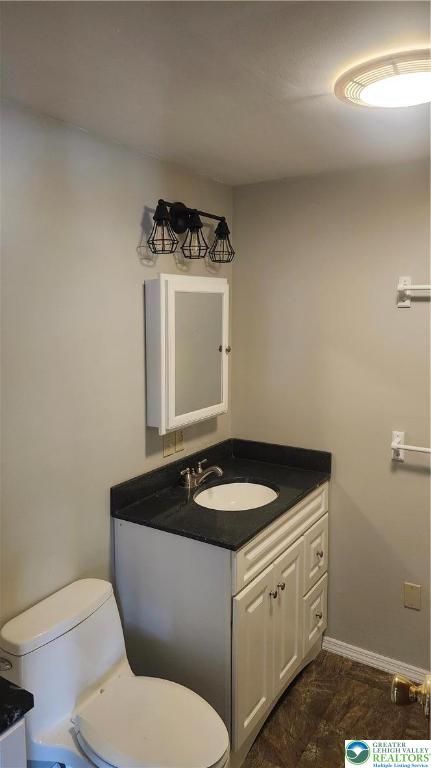 2121 Grove Street Allentown, PA 18104 - Photo 5 of 7 a bathroom with a granite countertop sink and a toilet