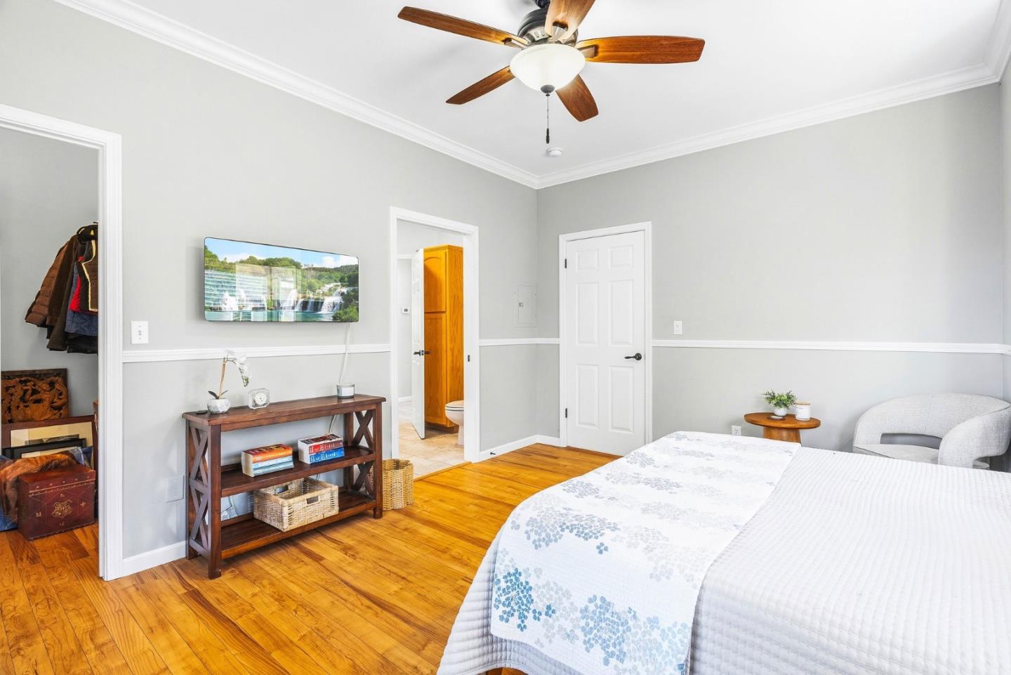 2500 Nelson Road Scotts Valley, CA 95066 - Photo 27 of 77 a bedroom with a bed and a chandelier
