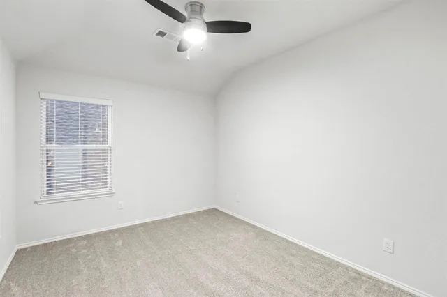 an empty room with a empty space and windows